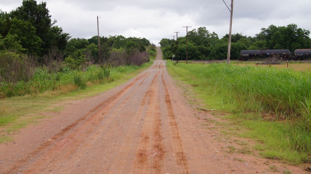 the Ozark Trail Alignment Part of RT66 1926-1930 Overnight storm turned red-dirt to sticky red mud. West of Stroud OK (OKh)