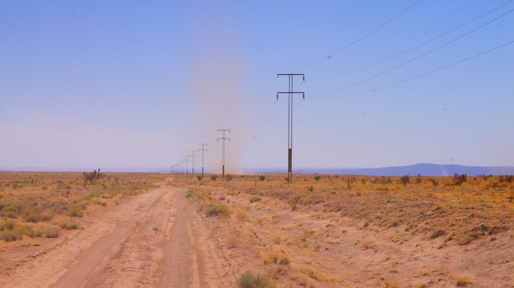 RT 66 1926-1932 Alignment from Santa Fe through La Bajada through Domingo to Algodones. Dust devil coming down the road.  (NM5)