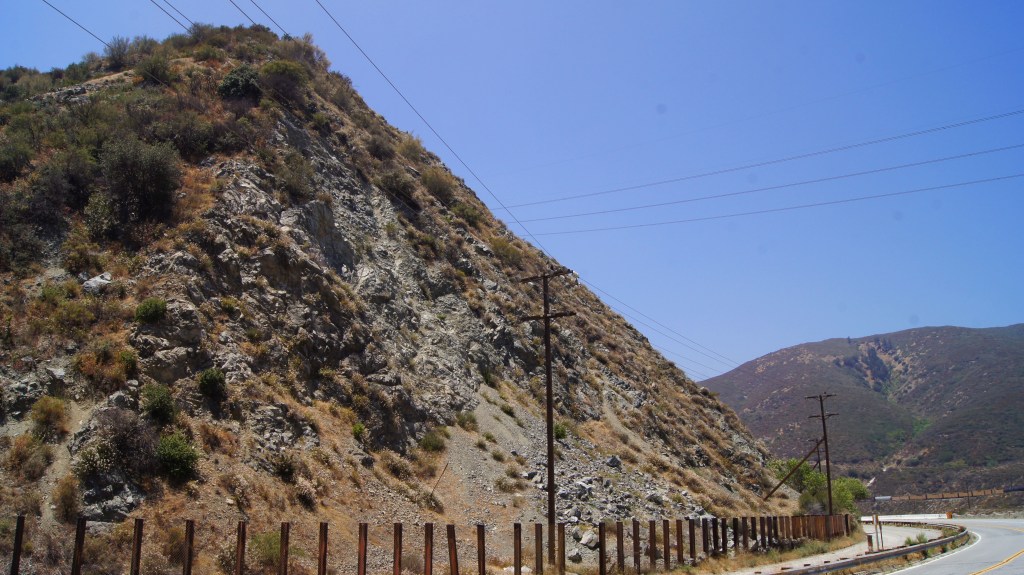 The Blue Cut - Cajon Pass This unstable hillside of bluestone is the reason why I15 was not built directly over the old alignment of RT66 in this area.  (CA1)